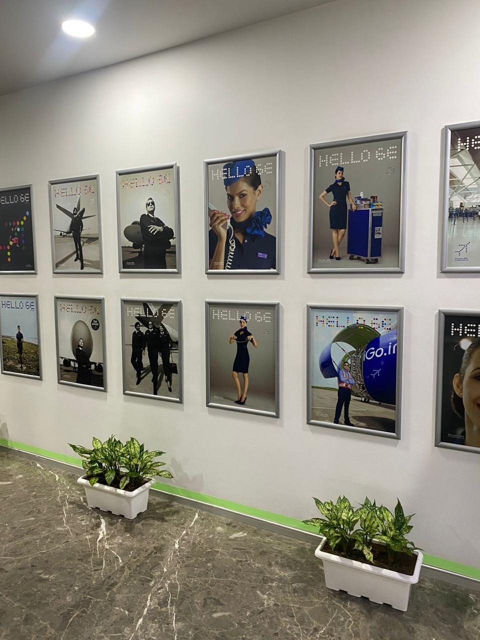 Corridor of an IndiGo airline training centre lined with cabin crew posters